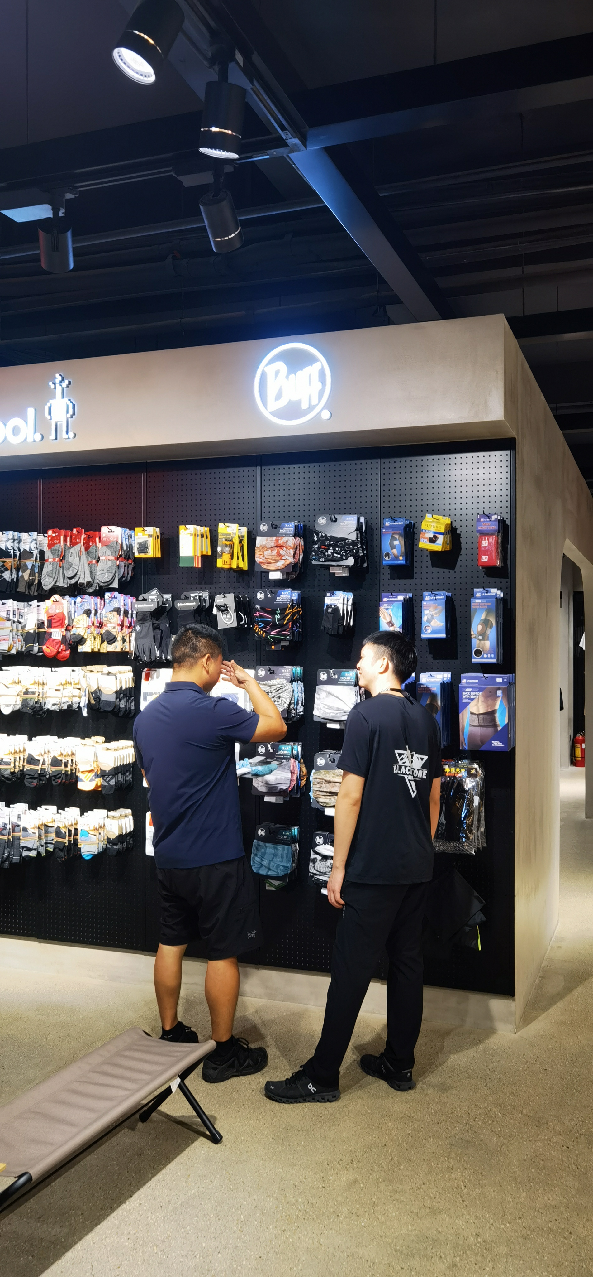 BUFF® headwear display wall at an outdoor specialty store in China