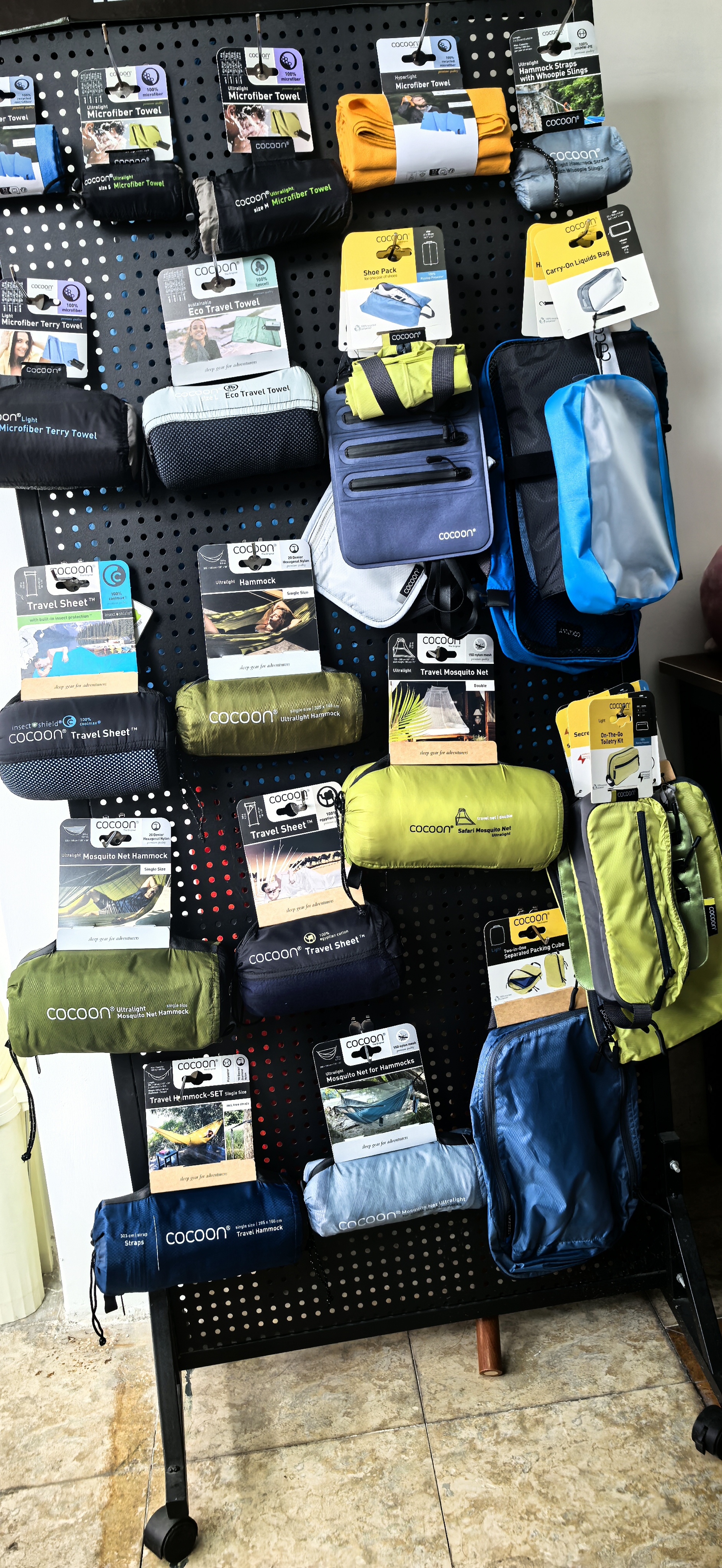 COCOON sleeping bags and travel sheets on display at a partner outdoor store