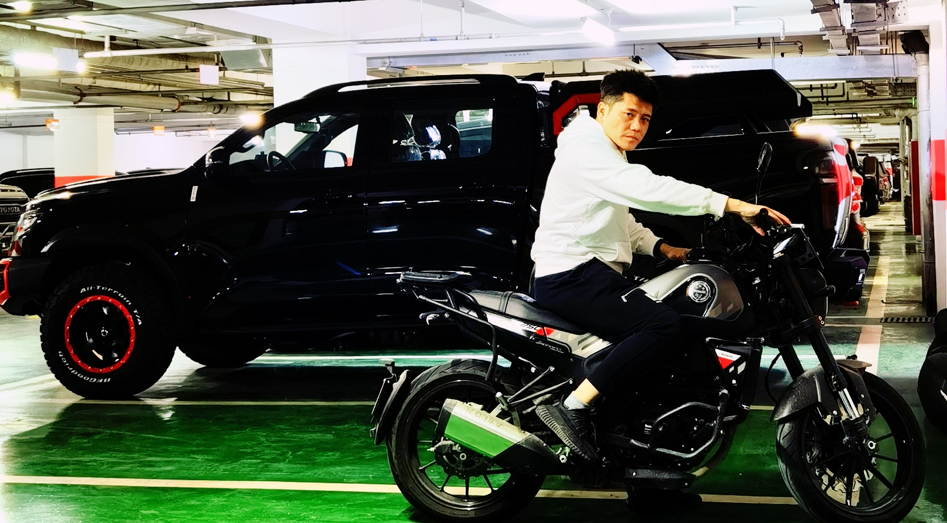 Frank Gao with his truck and mini-bike